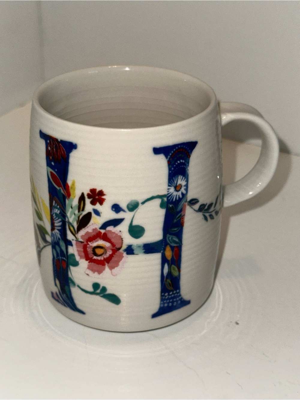 Anthropologie Starla Halfmann floral "H" monogram Petal Palette coffee mug